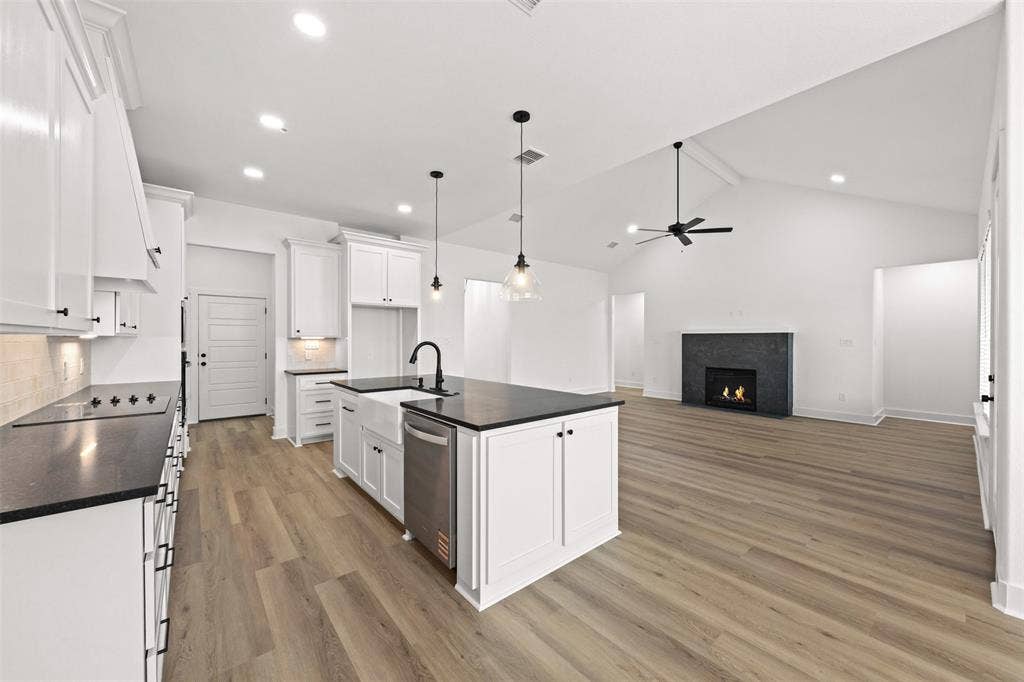 9820 Durango Trail, Waco, TX 76712 Open-concept kitchen and living area featuring wood-finish flooring