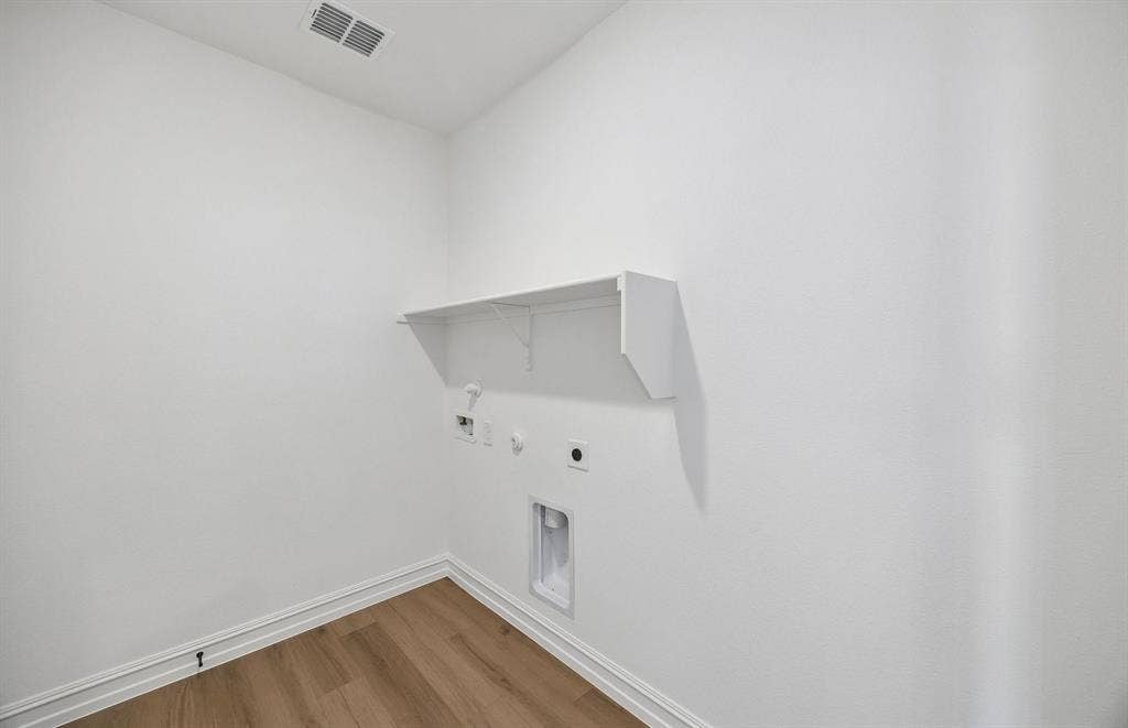4145 Gonzales Drive, McKinney, TX 75071 Laundry room with built-in shelving