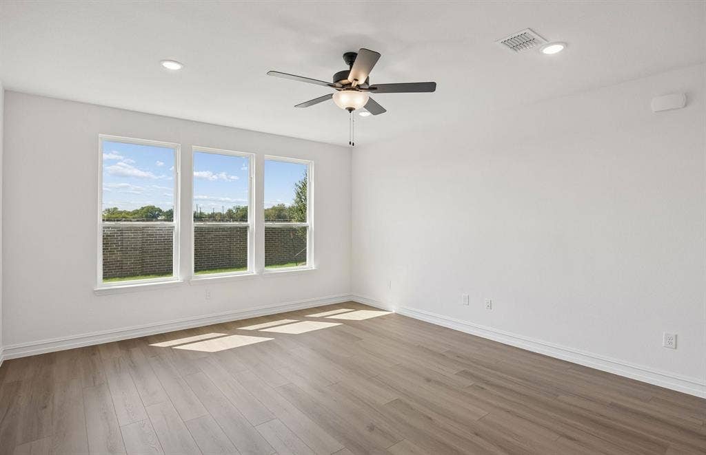 4145 Gonzales Drive, McKinney, TX 75071 Large windows and natural light in living room