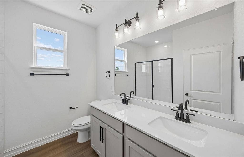4145 Gonzales Drive, McKinney, TX 75071 Secondary bath with double vanity