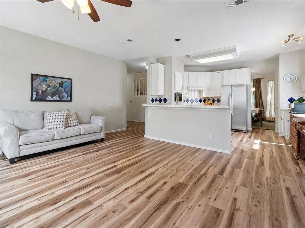 11379 Lockshire Drive, Frisco, TX 75035 Wood-finish flooring throughout the main living area
