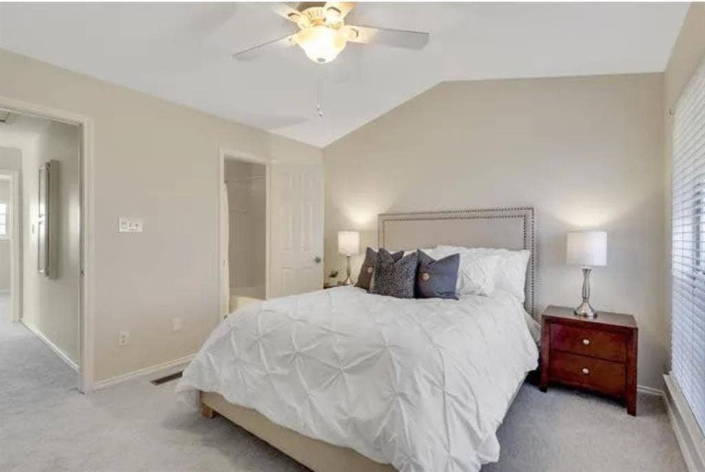 8400 Hickory Street, #1504, Frisco, TX 75034 Vaulted ceiling with an illuminated ceiling fan, neutral wall paint, and plush carpet flooring