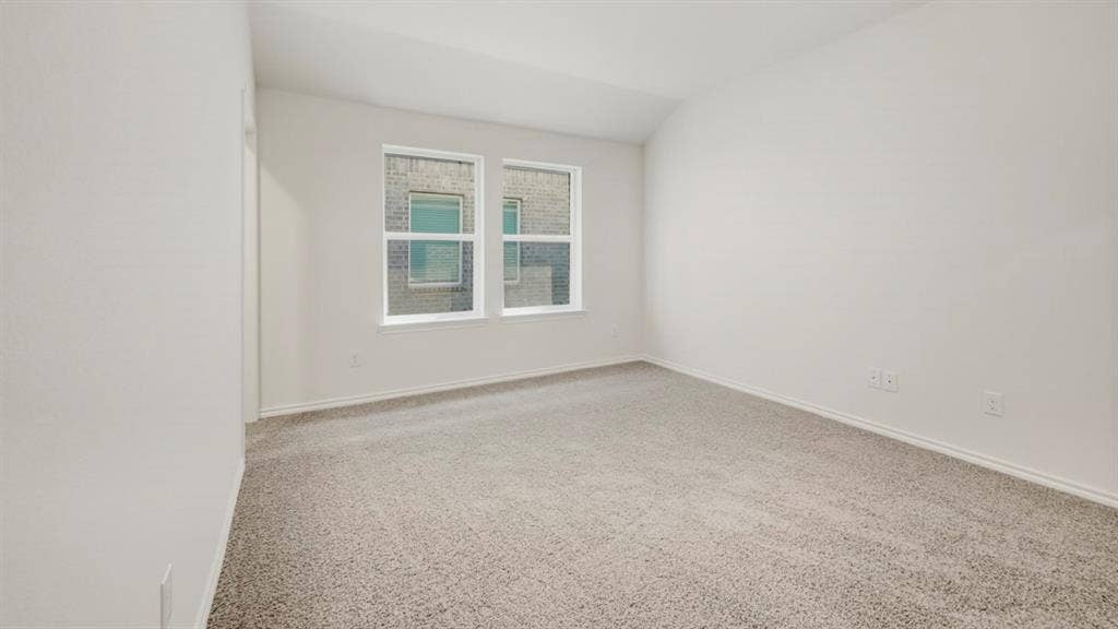 5032 Shumard Drive, Lindale, TX 75771 Spacious room featuring neutral paint, light gray carpet, and two large windows with white trim