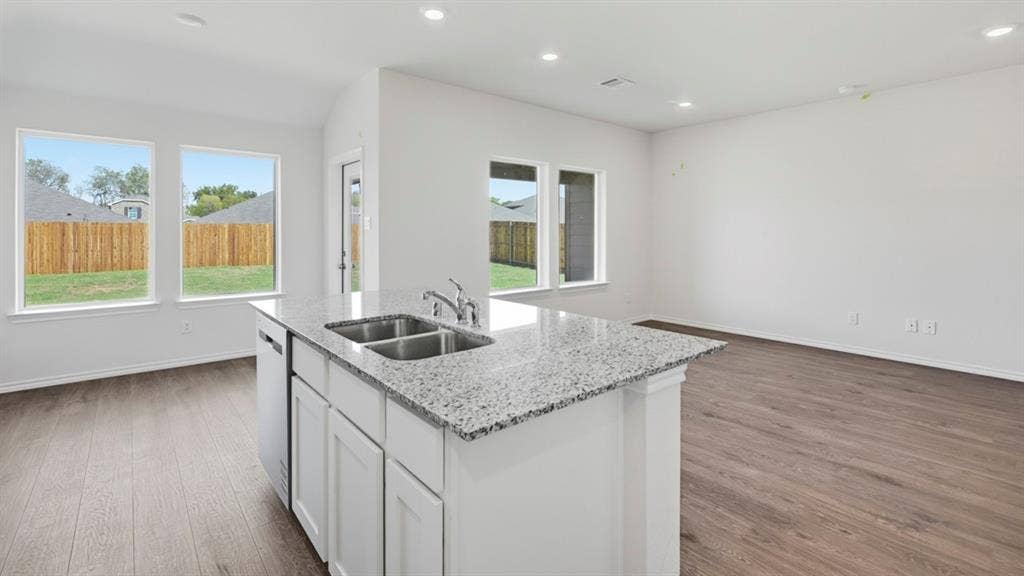 5032 Shumard Drive, Lindale, TX 75771 Open concept living area with a central kitchen island