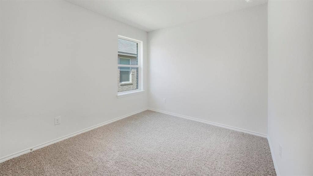5032 Shumard Drive, Lindale, TX 75771 Carpeted room featuring a single window with a white frame, white walls, and white baseboards