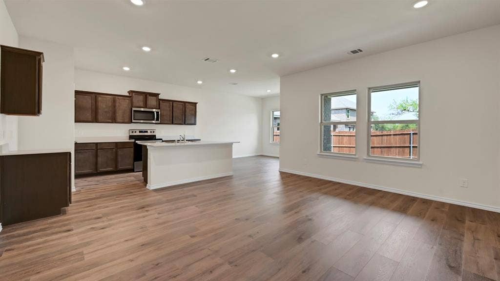 5024 Shumard Drive, Lindale, TX 75706 Open concept living space featuring wood-finish flooring