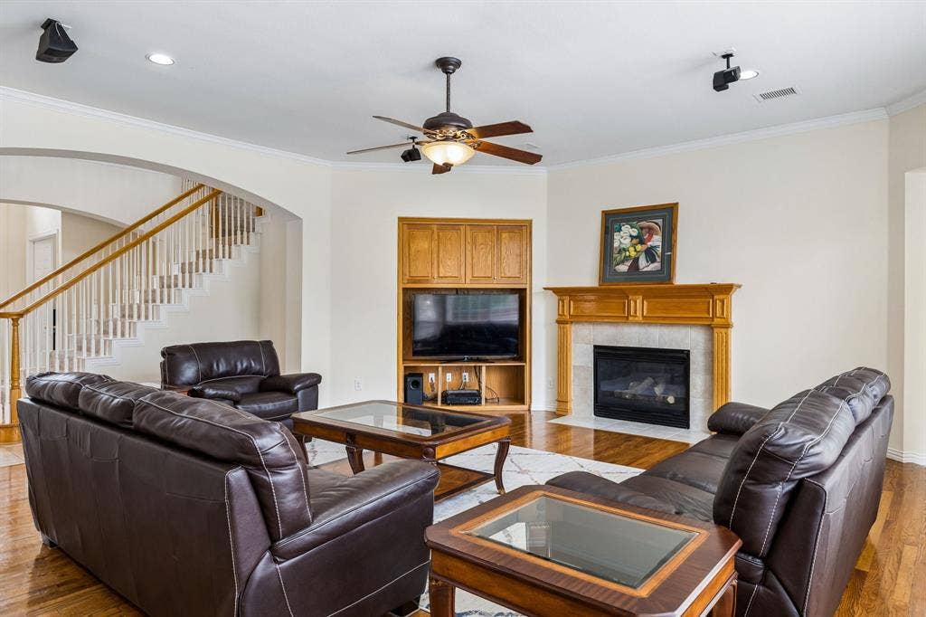 3809 Brookfield Drive, Plano, TX 75025 Perfect for festive gatherings or family game nights with all the right spaces! Decorative fireplace is center of attention.