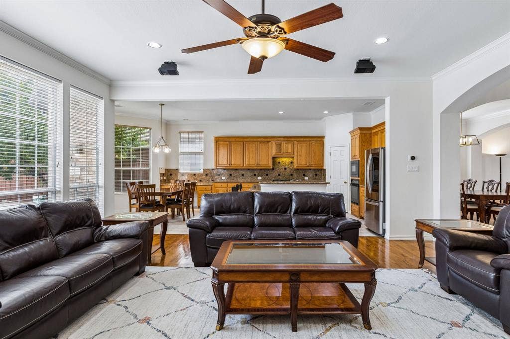 3809 Brookfield Drive, Plano, TX 75025 A picture's worth a thousand words! Living is easy in this impressive, generously spacious home. Natural light with floor to ceiling windows and an open concept unifying your living area and kitchen.