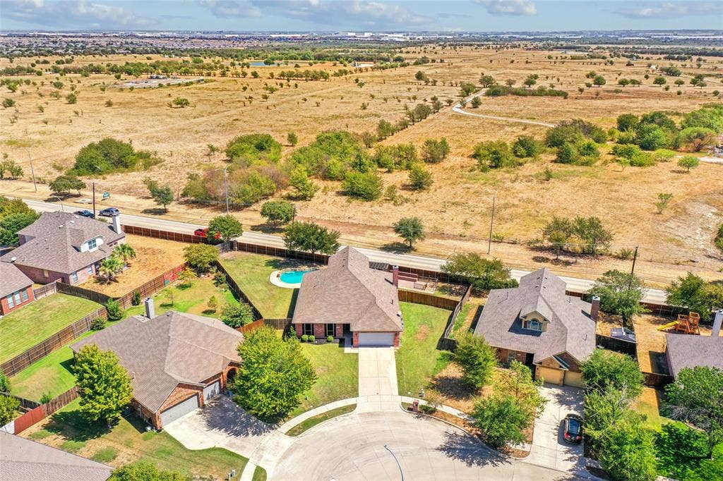 Cul-de-sac property featuring a fenced backyard with a swimming pool