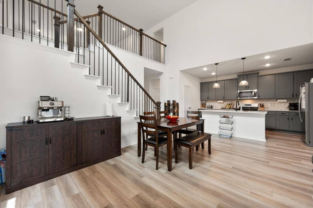 2325 Volans Drive, Haslet, TX 76052 Open-concept living space with wood-finish flooring