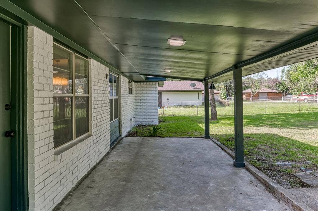 1138 Usher Street, Benbrook, TX 76126 Large covered patio provides shade while enjoying the outdoors