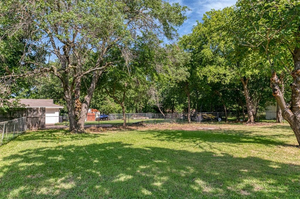 1138 Usher Street, Benbrook, TX 76126 Several mature trees in the yard