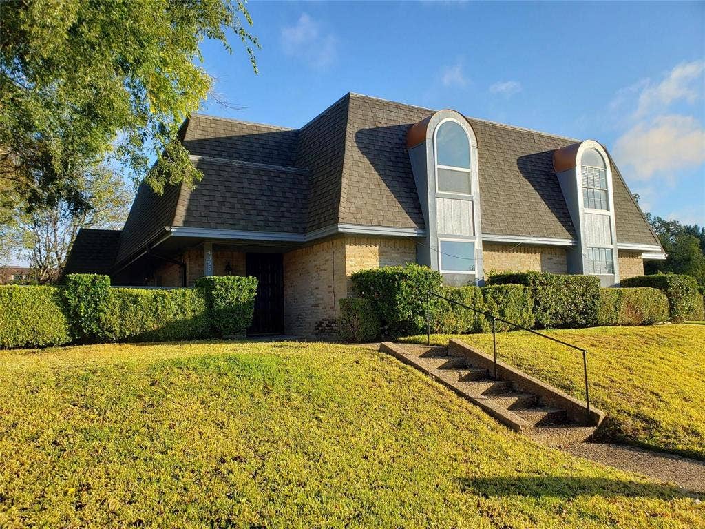 4355 Harvest Hill Road, Dallas, TX 75244 Front view of home set up above the street level.