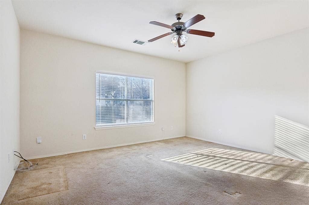 3019 Appaloosa Drive, Dallas, TX 75237 bedroom with carpet and ceiling fan