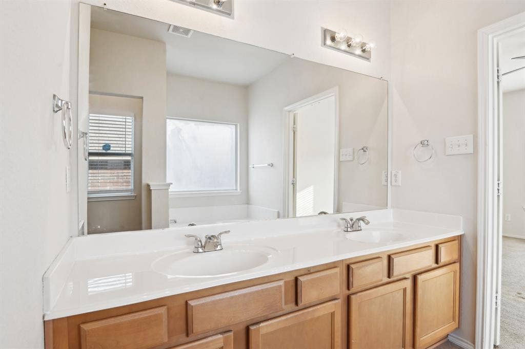 3019 Appaloosa Drive, Dallas, TX 75237 Bathroom with dual vanity sinks