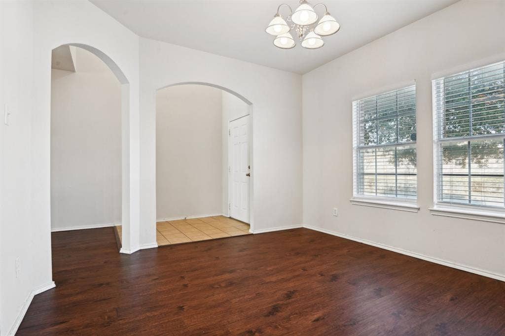 3019 Appaloosa Drive, Dallas, TX 75237 Unfurnished room featuring dark wood-type flooring