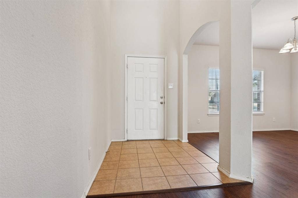 3019 Appaloosa Drive, Dallas, TX 75237 Entryway featuring light wood-type flooring and tile floors