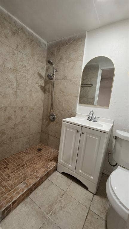 2018 Steamboat Springs Drive, Garland, TX 75044 Tiled shower enclosure with a mosaic tile base, featuring a chrome shower fixture