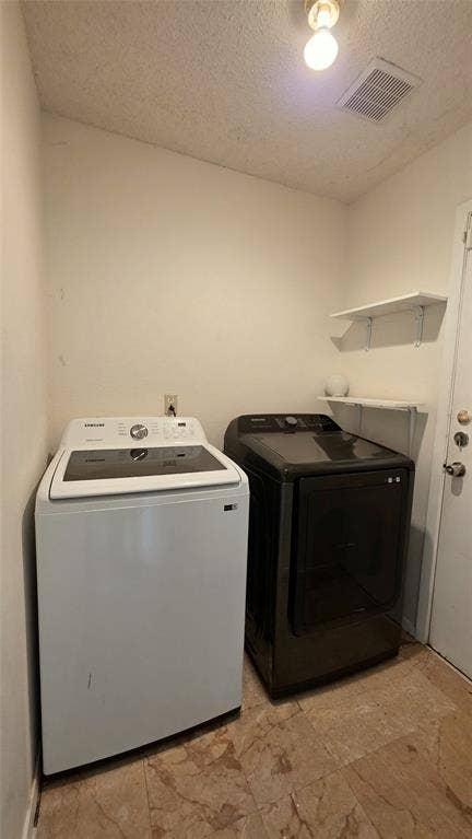 2018 Steamboat Springs Drive, Garland, TX 75044 Dedicated laundry space featuring a tiled floor, white walls, and built-in shelving