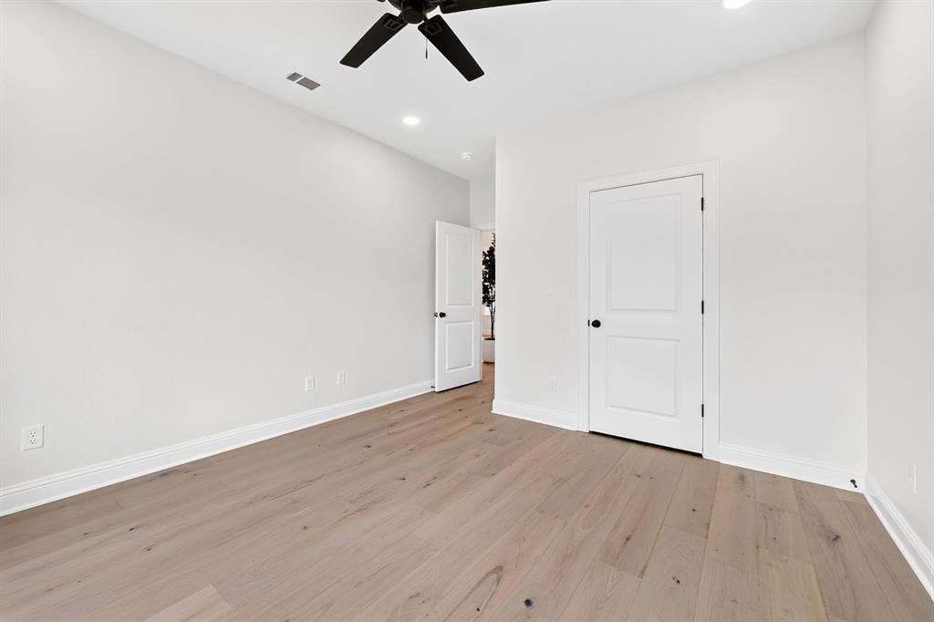 301 Grace Lane, Athens, TX 75751 Room featuring light wood-finish flooring, white walls, recessed lighting, and a black ceiling fan