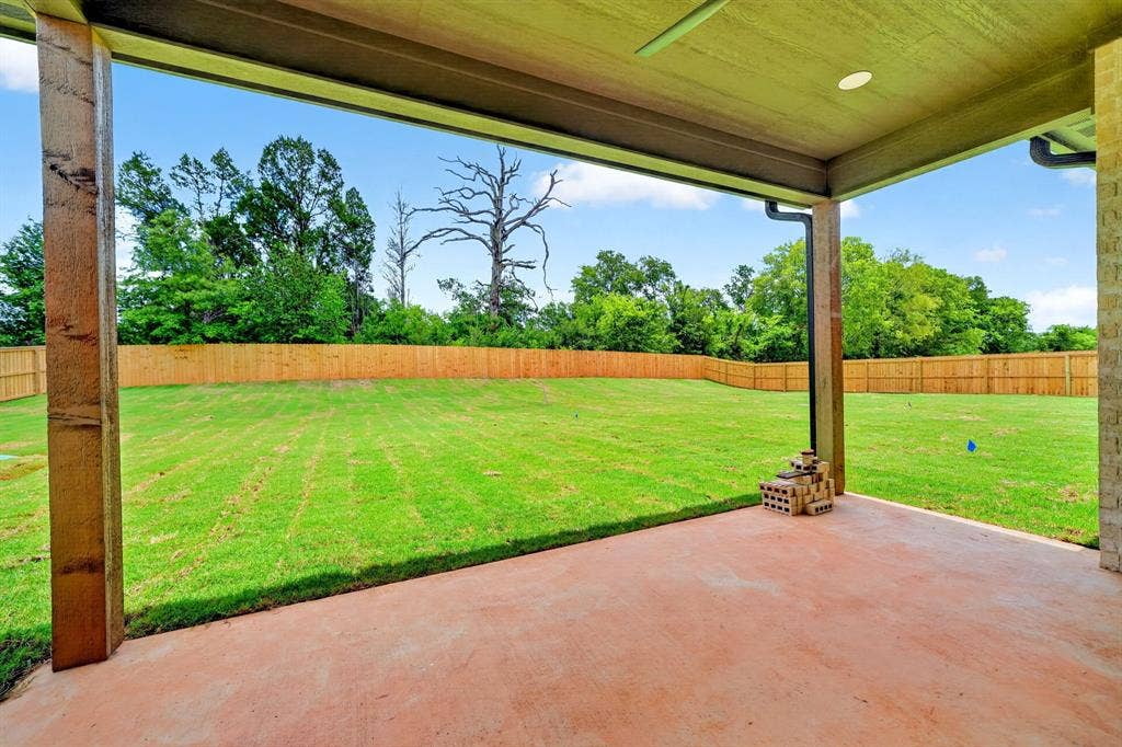 301 Grace Lane, Athens, TX 75751 Expansive backyard featuring a manicured lawn framed by a new wood privacy fence