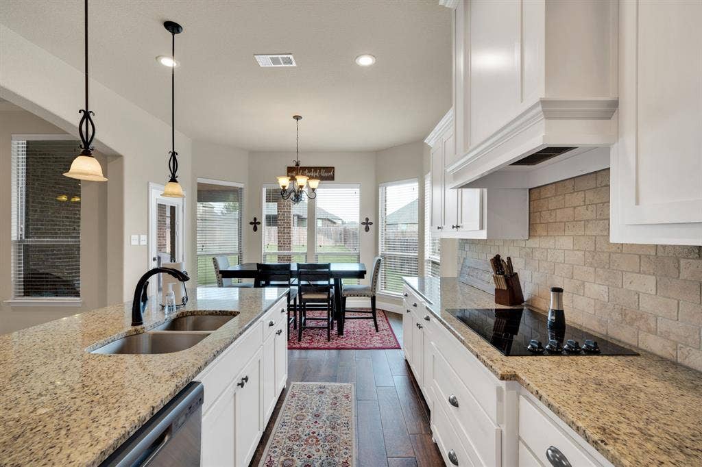 There is a seat for everyone. Whether it be casual dining at the kitchen island or sitting down more formal at your dining room table, this kitchen makes it all possible.