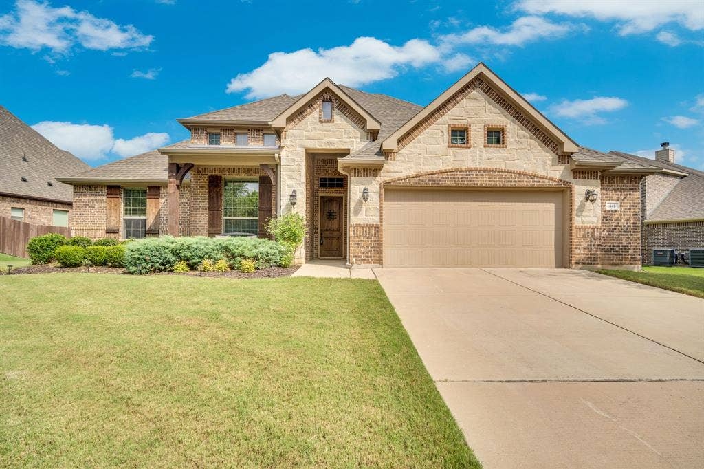 Home sits on an interior lot position that overlooks a natural green belt.