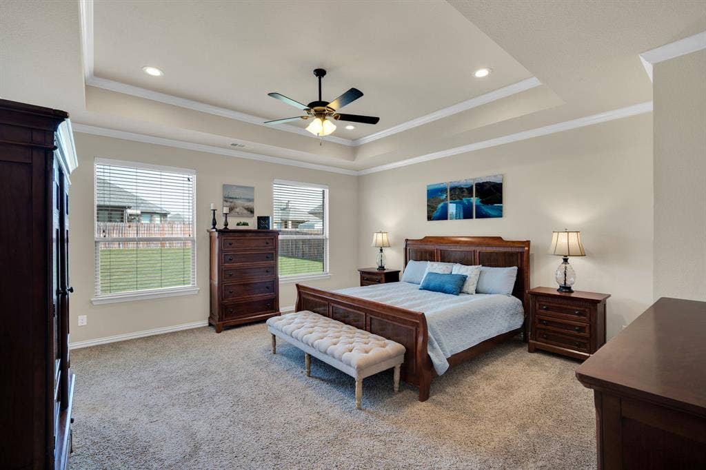 First floor Primary suite overlooks the large backyard. The room provides ample space. It was designed by the seller to be oversized for extra room and privacy.