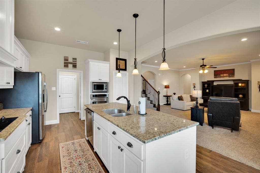 A kitchen built for the one who enjoy serving others and having those special folks right there with ya while you are making those week night meals.