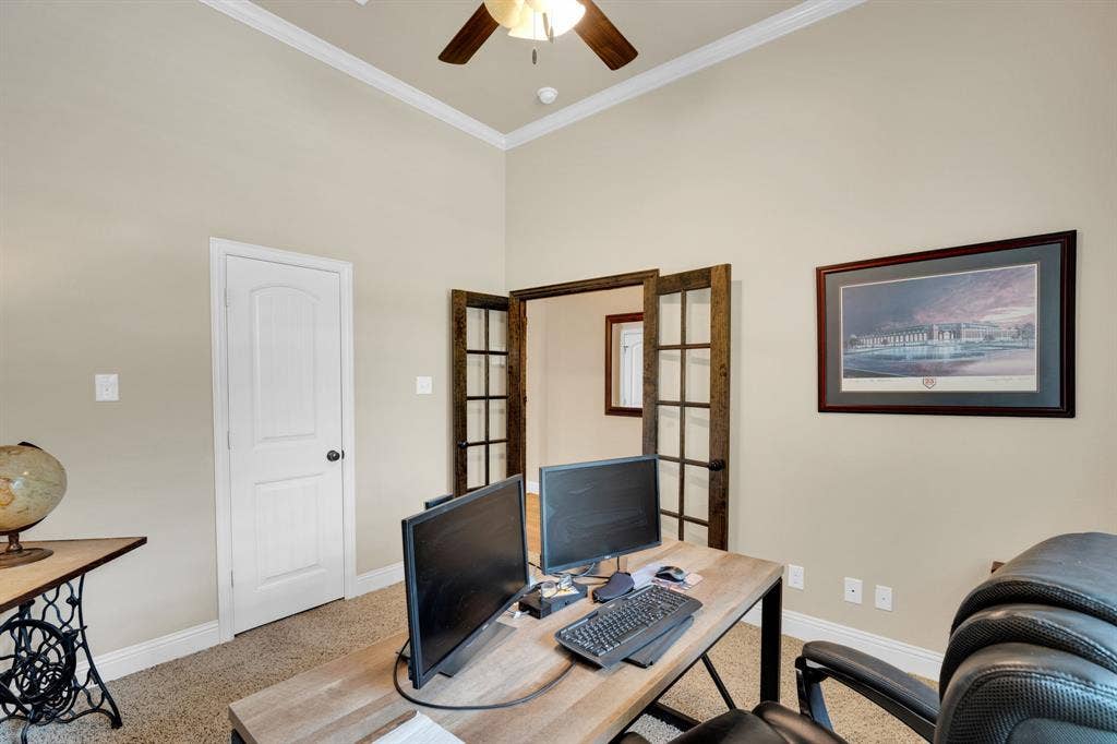 Office on the first floor with a large walk in closet and has built in shelves to create easy organization accommodations. This space could also be used as a 5th bedroom if one was needed. The office faces the street and the room fills beautifully with natural light.