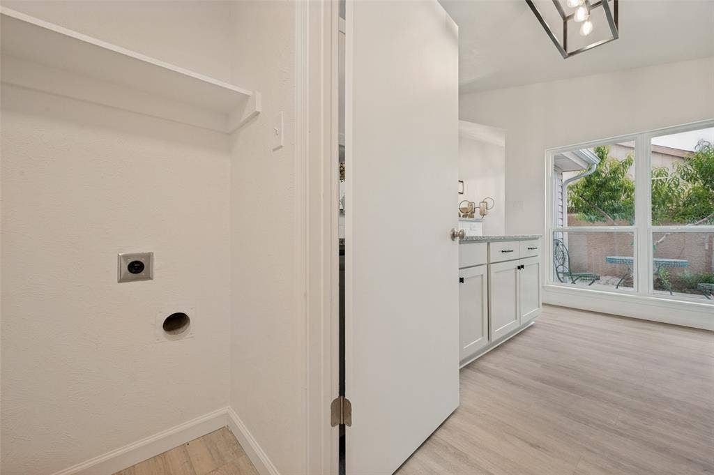 412 Pogue Street, Cedar Hill, TX 75104 Dedicated laundry area with an overhead shelf and hookups