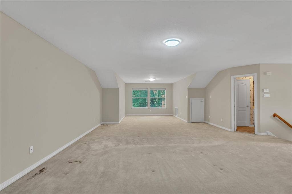 upstairs bonus room/bedroom with ensuite full bath oom