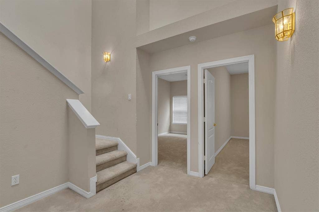 view of staircase and 3rd & 4th downstairs bedrooms