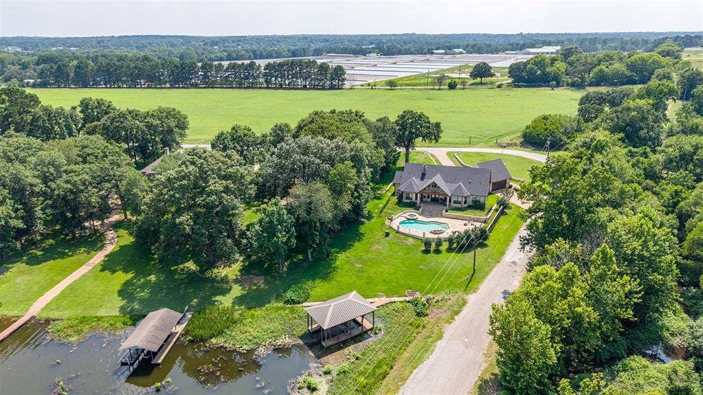 6414 Dorsey Drive, Athens, TX 75752 Expansive property featuring a residence with a covered front entrance and a paved driveway