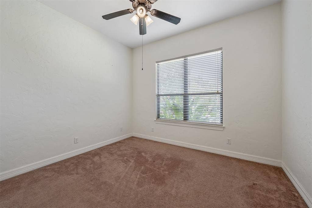 6414 Dorsey Drive, Athens, TX 75752 Carpeted room featuring a ceiling fan with integrated lighting, a window with horizontal blinds, textured walls, and white baseboards