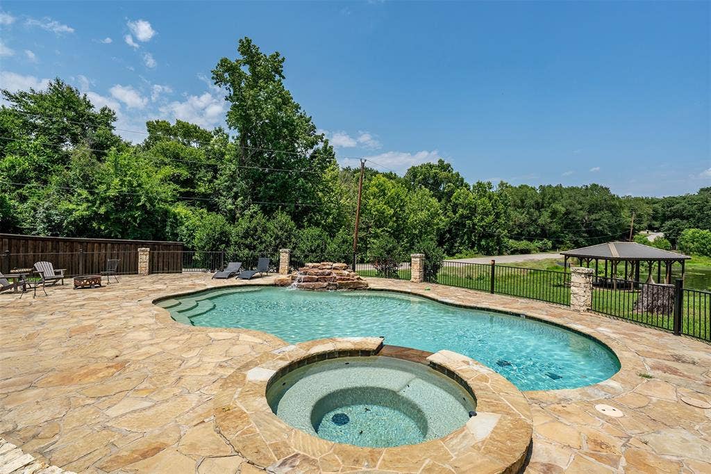 6414 Dorsey Drive, Athens, TX 75752 Freeform swimming pool with integrated spa and stone waterfall feature
