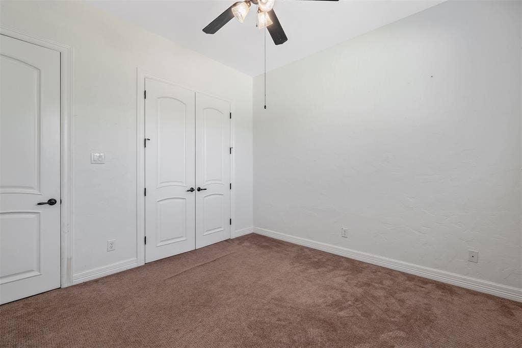 6414 Dorsey Drive, Athens, TX 75752 Neutral tone walls with brown carpet flooring