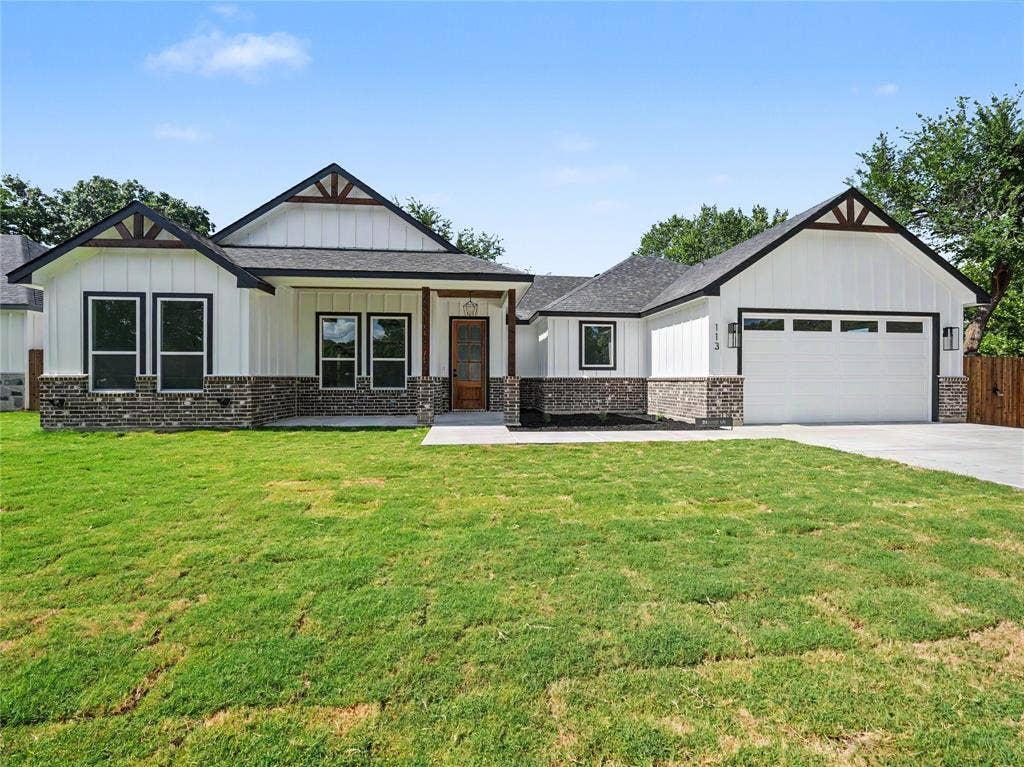 113 Dennis Drive, Azle, TX 76020 Modern farmhouse-style exterior featuring white vertical siding and dark brick accents