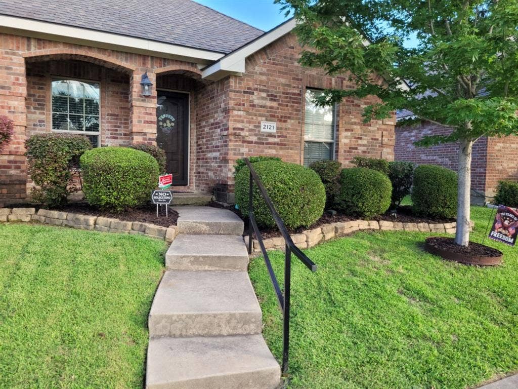 2121 Colby Lane, Wylie, TX 75098 Nice curb appeal with front porch and railing for steps.