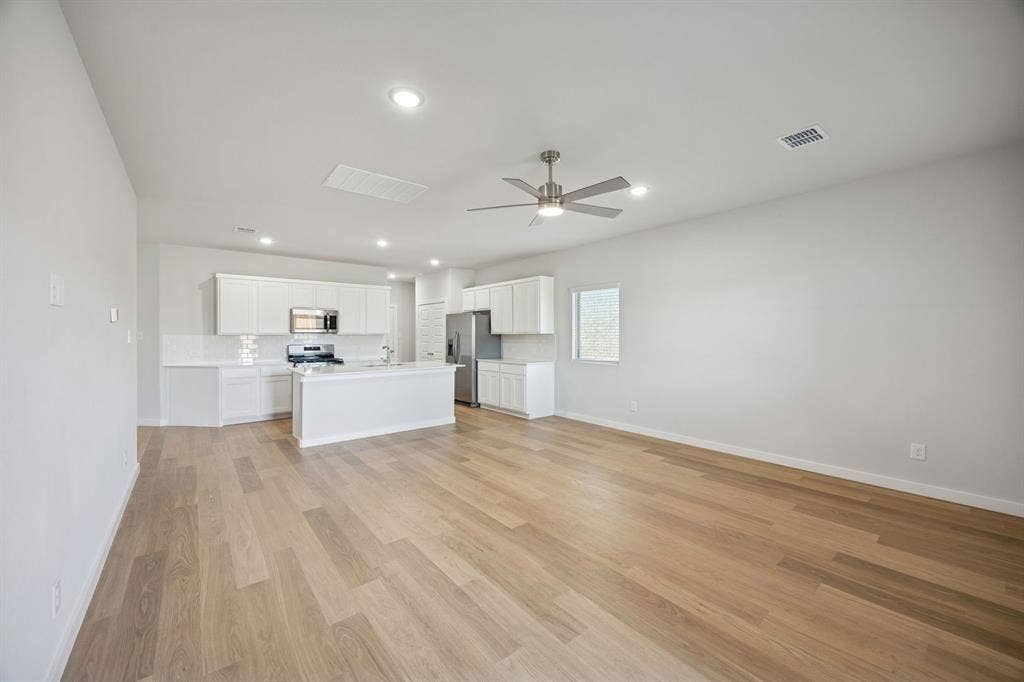 522 Green Gables Drive, Princeton, TX 75071 Living Room in the Oak II home plan by Trophy Signature Homes – REPRESENTATIVE PHOTO