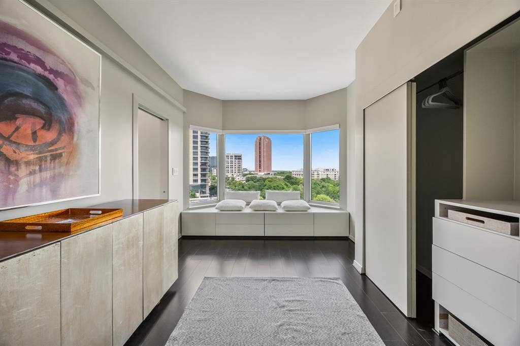 3030 Mckinney Avenue, #701, Dallas, TX 75204 Dedicated dressing area with a window seat, built-in cabinetry, and closet storage.
