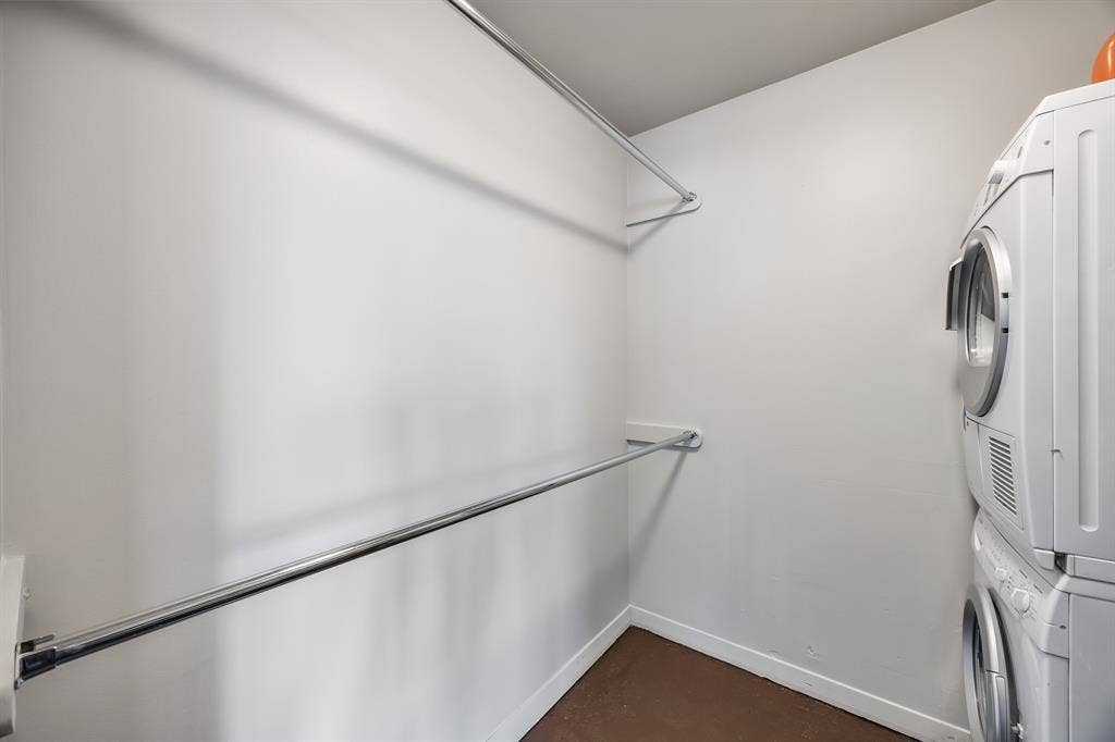 3030 Mckinney Avenue, #701, Dallas, TX 75204 Dedicated utility room with a stacked washer and dryer plus added storage.