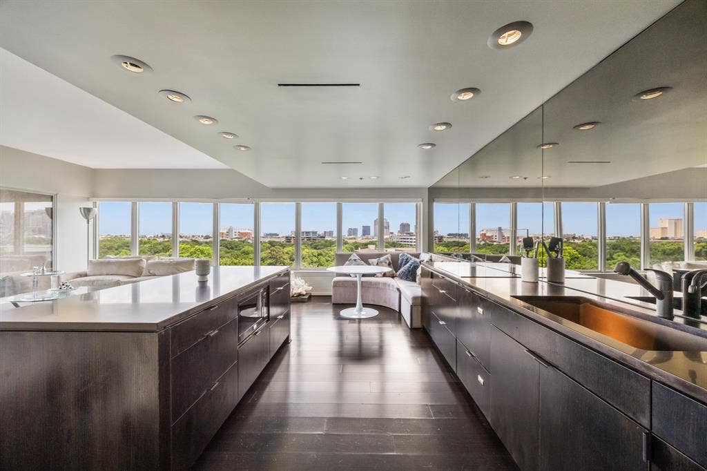 3030 Mckinney Avenue, #701, Dallas, TX 75204 Sleek kitchen with a built-in refrigerator and extensive cabinetry.