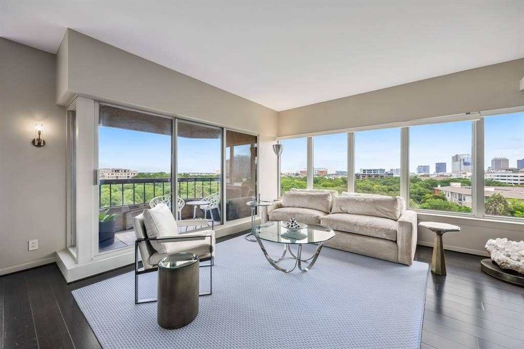 3030 Mckinney Avenue, #701, Dallas, TX 75204 A bright sitting area with picture-window views and direct access to the private balcony.