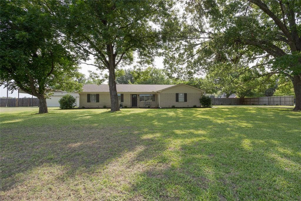 3999 Speegleville Road, Waco, TX 76712 Beautifully maintained front yard and mature trees give this home great curb appeal