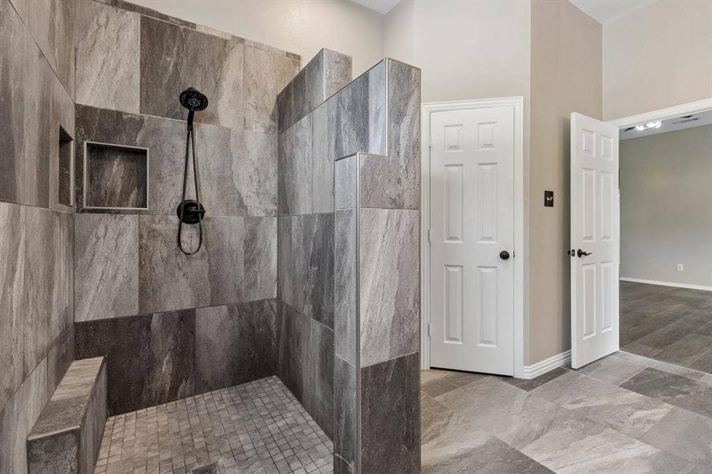607 Grimsworth Court, Allen, TX 75002 Large walk-in shower with beautiful tile work.