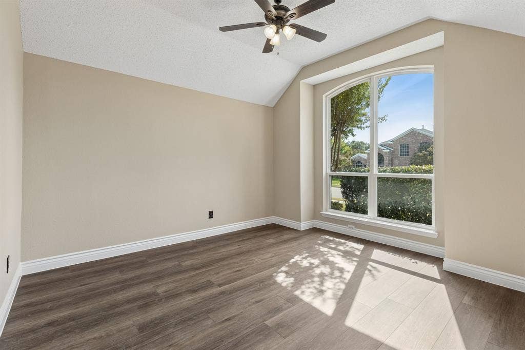 607 Grimsworth Court, Allen, TX 75002 The formal dining or living space with vaulted ceiling offers ceiling fan, fresh paint, and new LVP flooring.