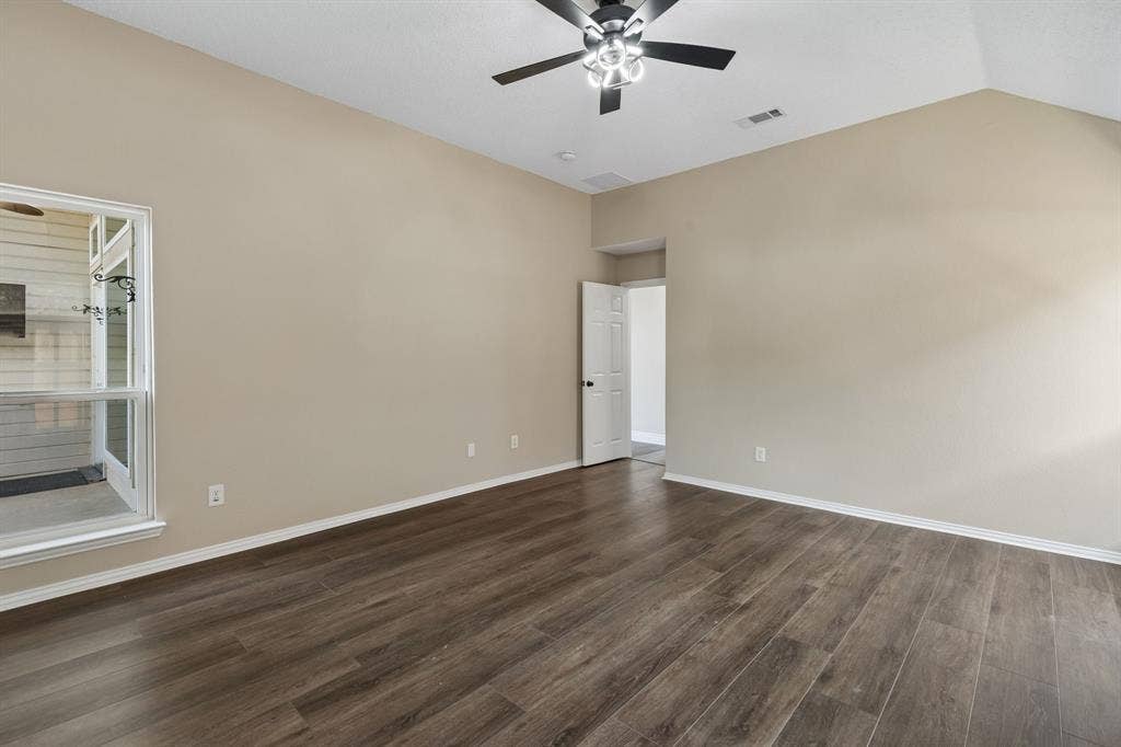 607 Grimsworth Court, Allen, TX 75002 Primary bedroom has great natural light and aceiling fan and fresh paint.