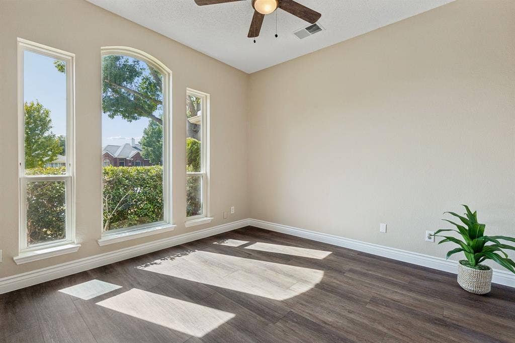 607 Grimsworth Court, Allen, TX 75002 This bedroom toward the front of the home iscurrently used as an office. The room boasts New LVP flooring, fresh paint, and a ceiling fan.
