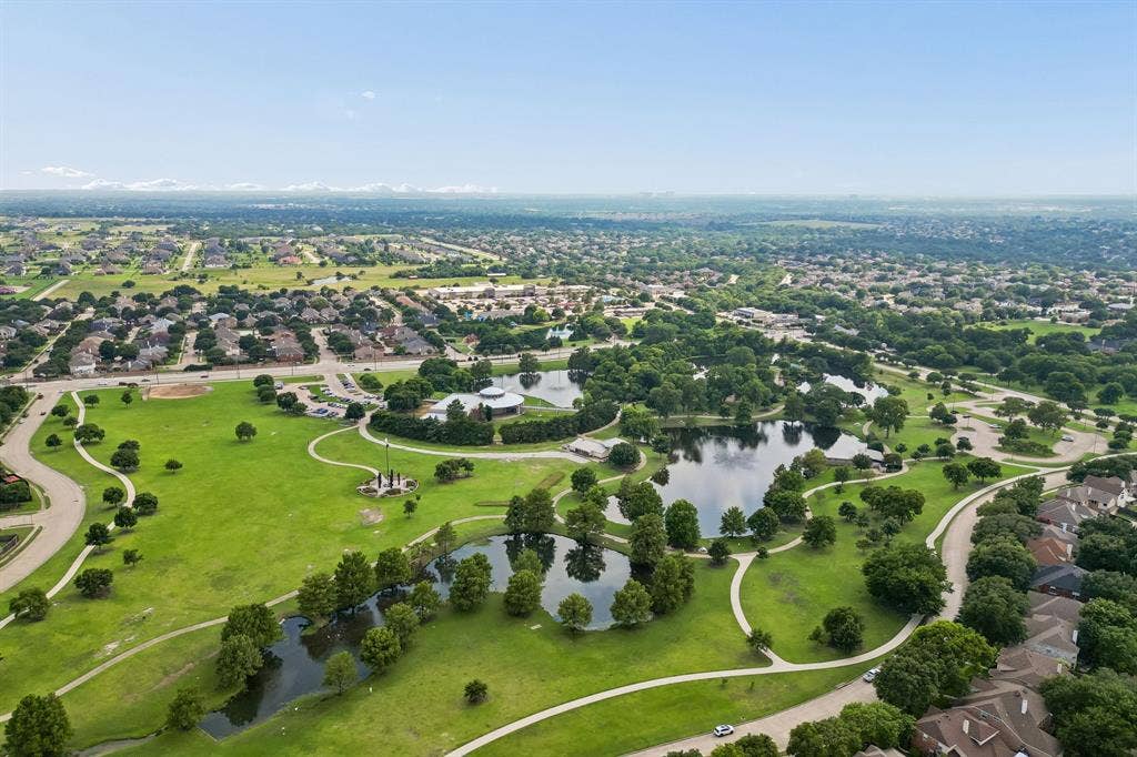 607 Grimsworth Court, Allen, TX 75002 Aerial view looking toward Shadow Lakes Park. Thepark is a short walk from the home.
